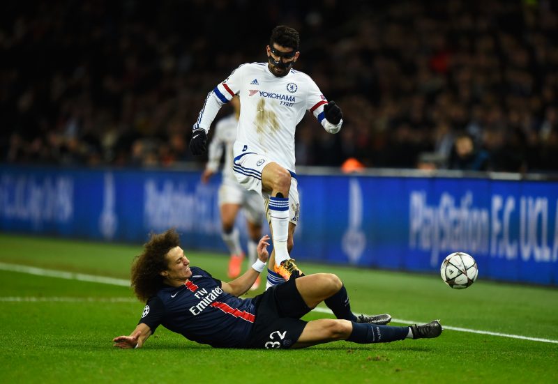 PARIS, FRANCE - FEBRUARY 16: David Luiz of Paris Saint-Germain slides to tackle Diego Costa of Chelsea during the UEFA Champions League round of 16 first leg match between Paris Saint-Germain and Chelsea at Parc des Princes on February 16, 2016 in Paris, France. (Photo by Mike Hewitt/Getty Images)