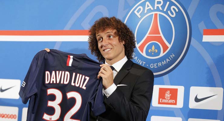 Paris: Brazil's David Luiz holds his soccer shirt, as he poses for photographers following a press conference, in Paris, Thursday, Aug. 7, 2014. Defender Luiz believes the only way to get over his World Cup disappointment is to be back on the pitch as quickly as possible. French champion Paris Saint-Germain signed Luiz on a five-year deal that was announced before his lackluster performances in Brazil's last two games at the World Cup last month. AP/PTI(AP8_7_2014_000159A)
