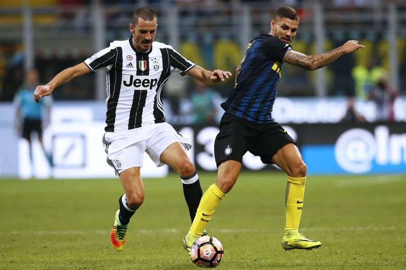 Juventus' defender Leonardo Bonucci (L) vies with Inter Milan's Argentinina forward Mauro Emanuel Icardi during the Italian Serie A football match Inter Milan Vs Juventus on September 18, 2016 at the San Siro Stadium in Milan.  / AFP / MARCO BERTORELLO        (Photo credit should read MARCO BERTORELLO/AFP/Getty Images)