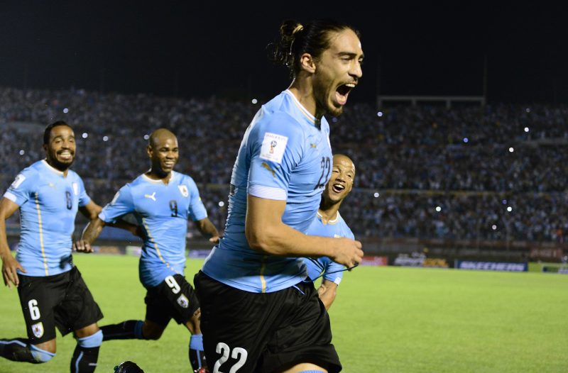 Uruguay's Martin Caceres celebrates after scoring against Chile during their Russia 2018 FIFA World Cup South American Qualifiers football match, in Montevideo, on November 17, 2015.   AFP PHOTO / PABLO PORCIUNCULA        (Photo credit should read PABLO PORCIUNCULA/AFP/Getty Images)
