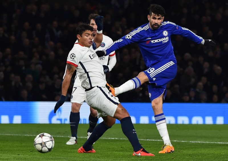 Chelsea's Brazilian-born Spanish striker Diego Costa (R) gets his shot past Paris Saint-Germain's Brazilian defender Thiago Silva (L) to score their first goal to equalise 1-1 during the UEFA Champions League round of 16 second leg football match between Chelsea and Paris Saint-Germain (PSG) at Stamford Bridge in London on March 9, 2016. / AFP / BEN STANSALL (Photo credit should read BEN STANSALL/AFP/Getty Images)