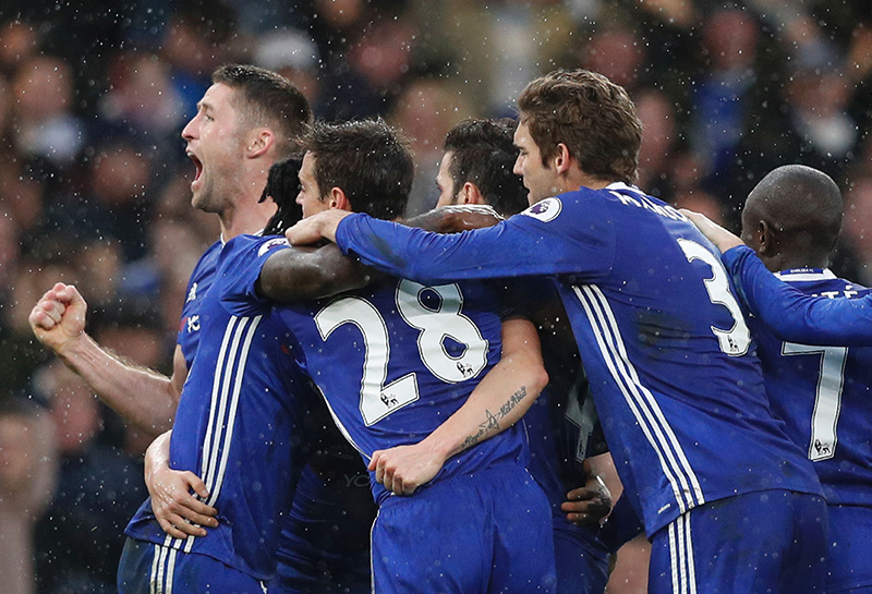 The team celebrating Pedro's goal to regain Chelsea's lead against Swansea.