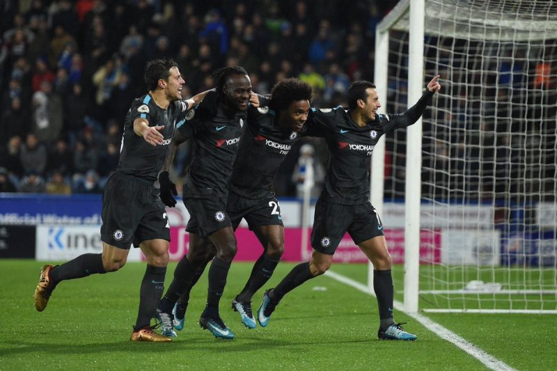 Chelsea players celebrating in a 3-1 win over Huddersfield Town.
