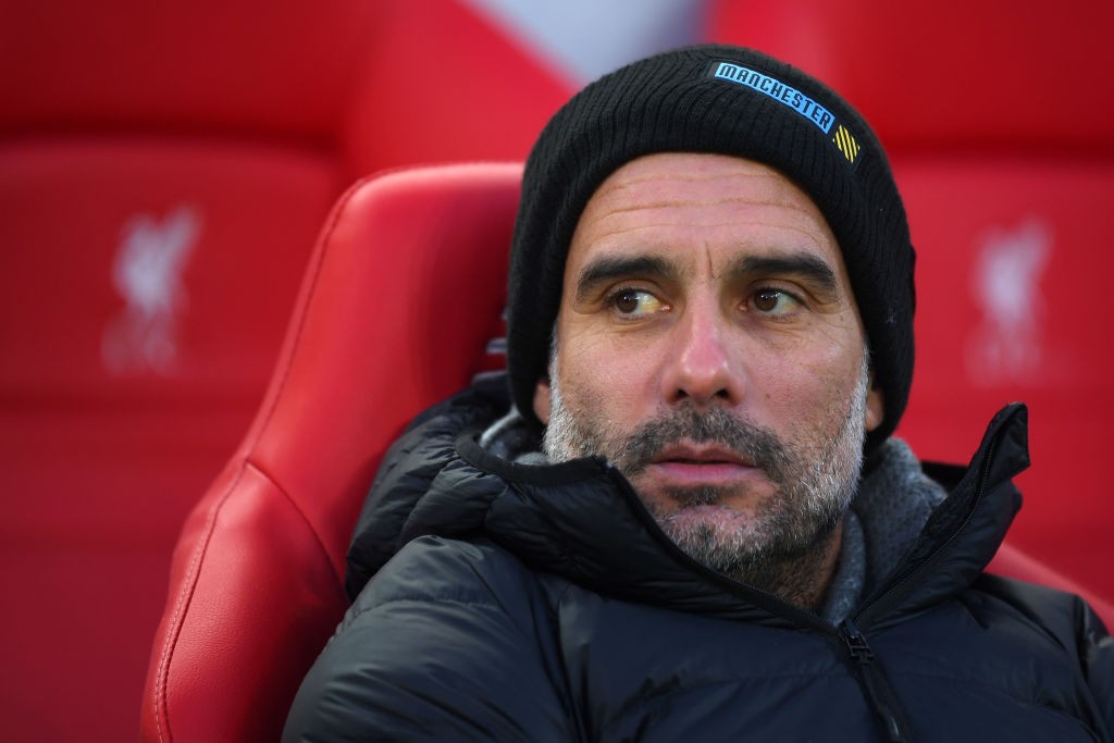 Pep Guardiola in the dugout for Man City