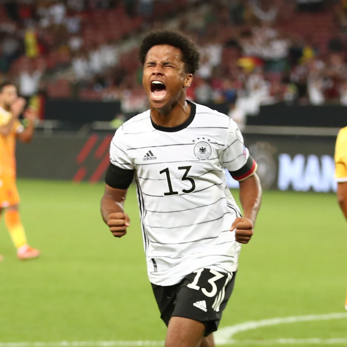 Karim Adeyemi celebrates a goal for Germany.
