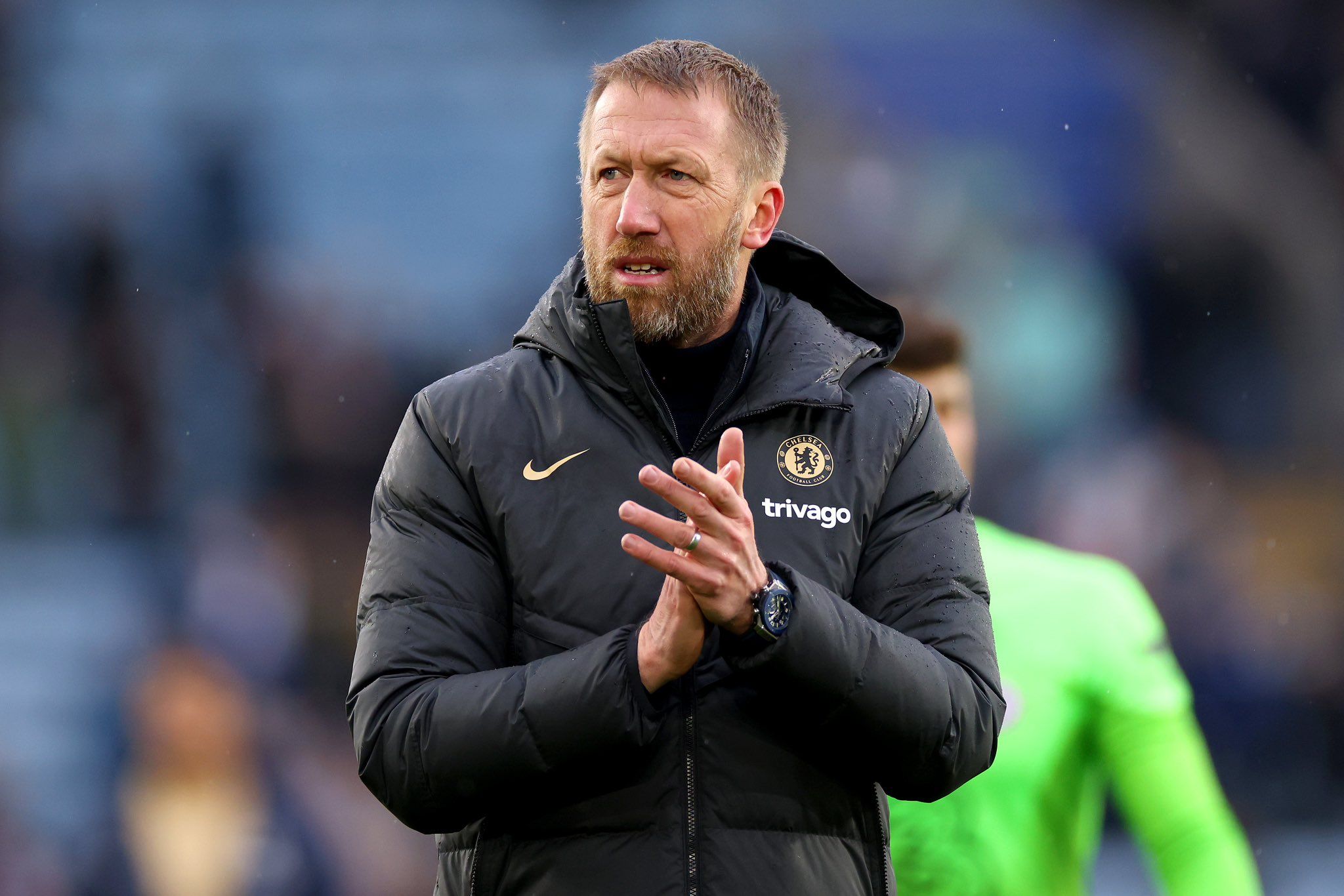 Graham Potter applauds the Chelsea fans.
