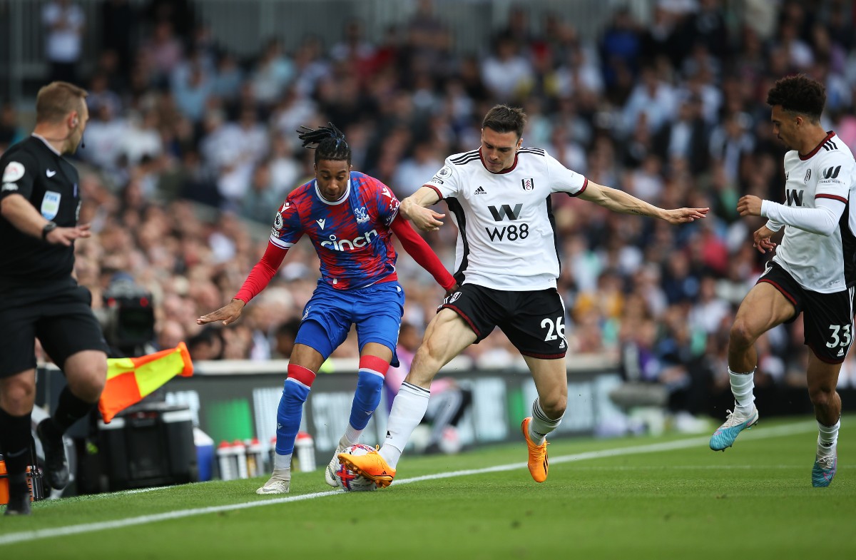 Michael Olise dribbles down the line.