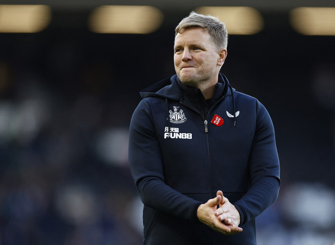 Eddie Howe celebrates on the touchline.