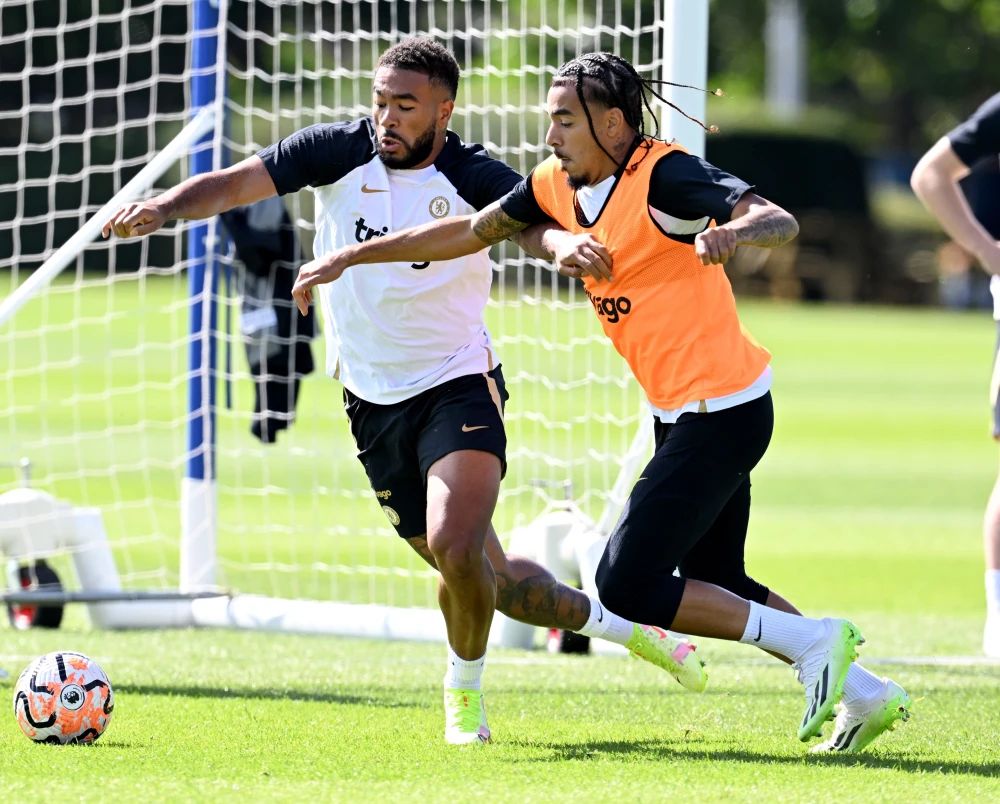 Malo Gusto and Reece James compete in training.