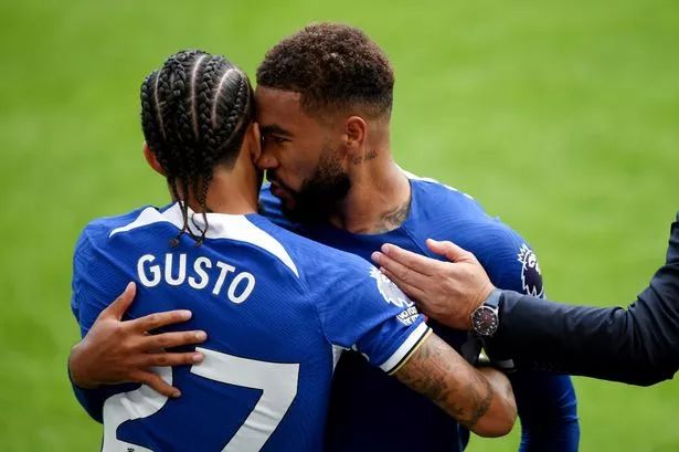 Malo Gusto and Reece James celebrate together.