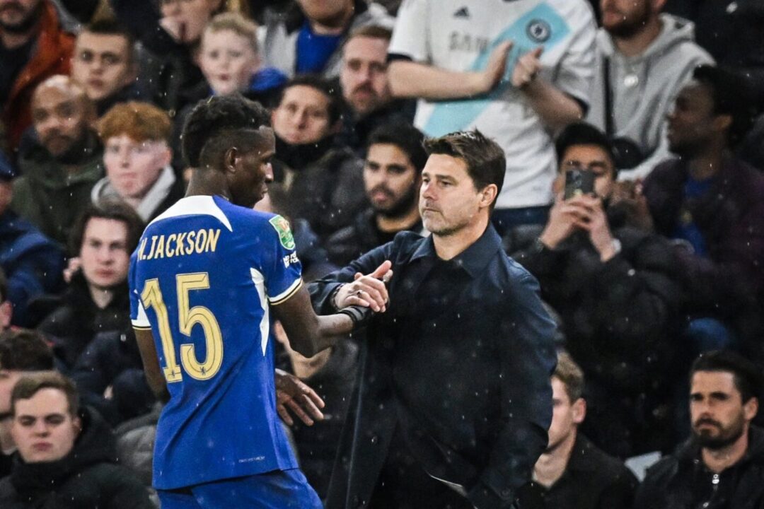 Nicolas Jackson embraces Mauricio Pochettino after being subbed