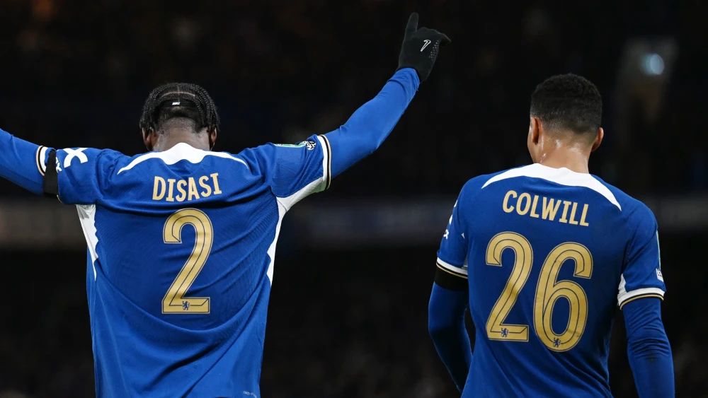 Axel Disasi and Levi Colwill celebrate a clean sheet.