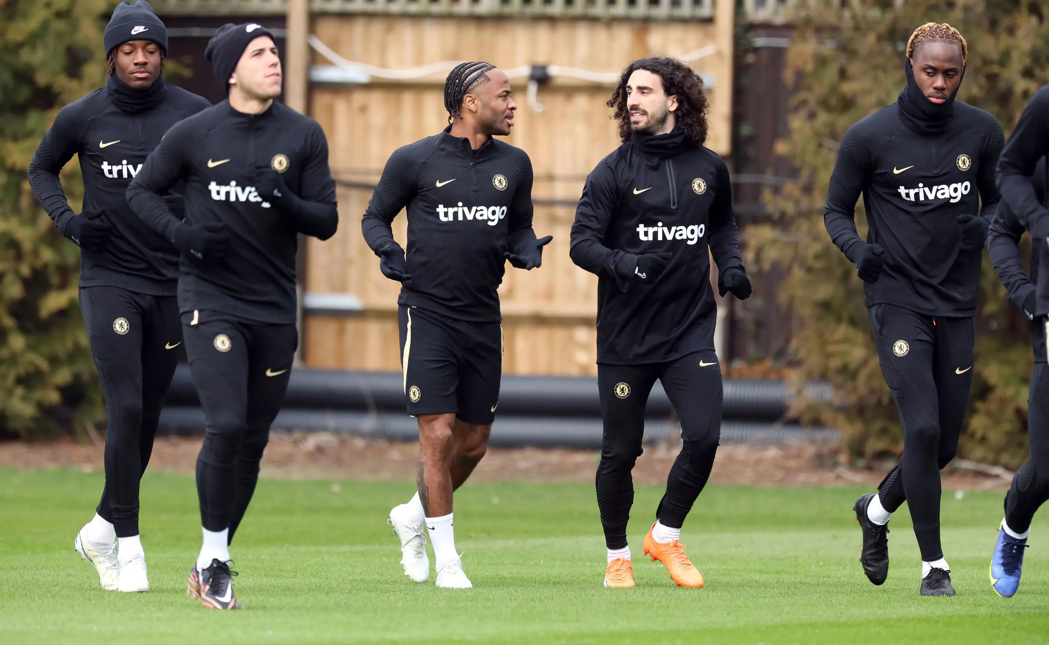 Chelsea players warm up in training.