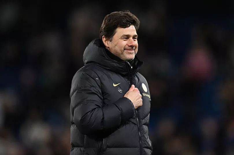 Mauricio Pochettino smiles after a big Chelsea win.