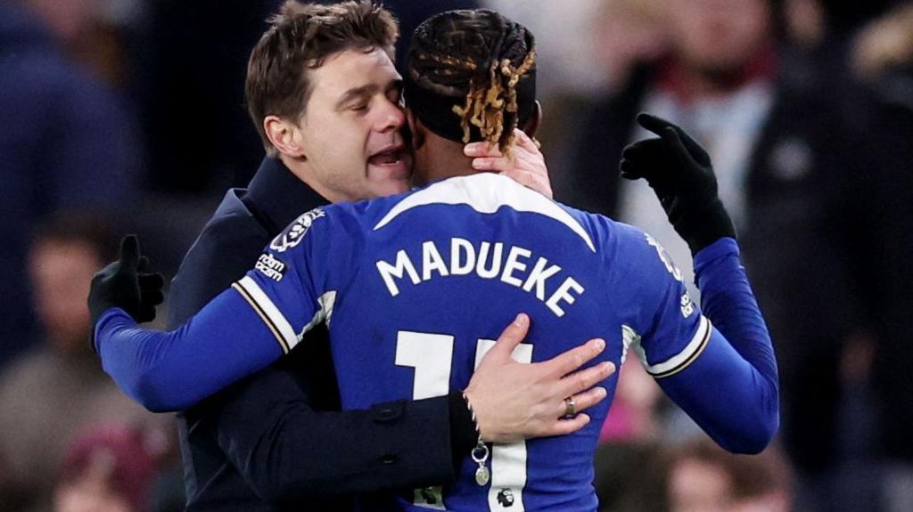 Noni Madueke and Mauricio Pochettino embrace. Noni Madueke and Mauricio Pochettino embrace.