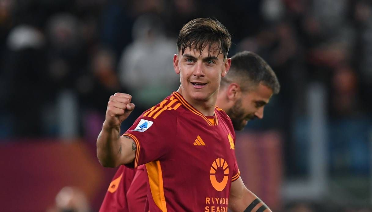 Paulo Dybala celebrates scoring for Roma.