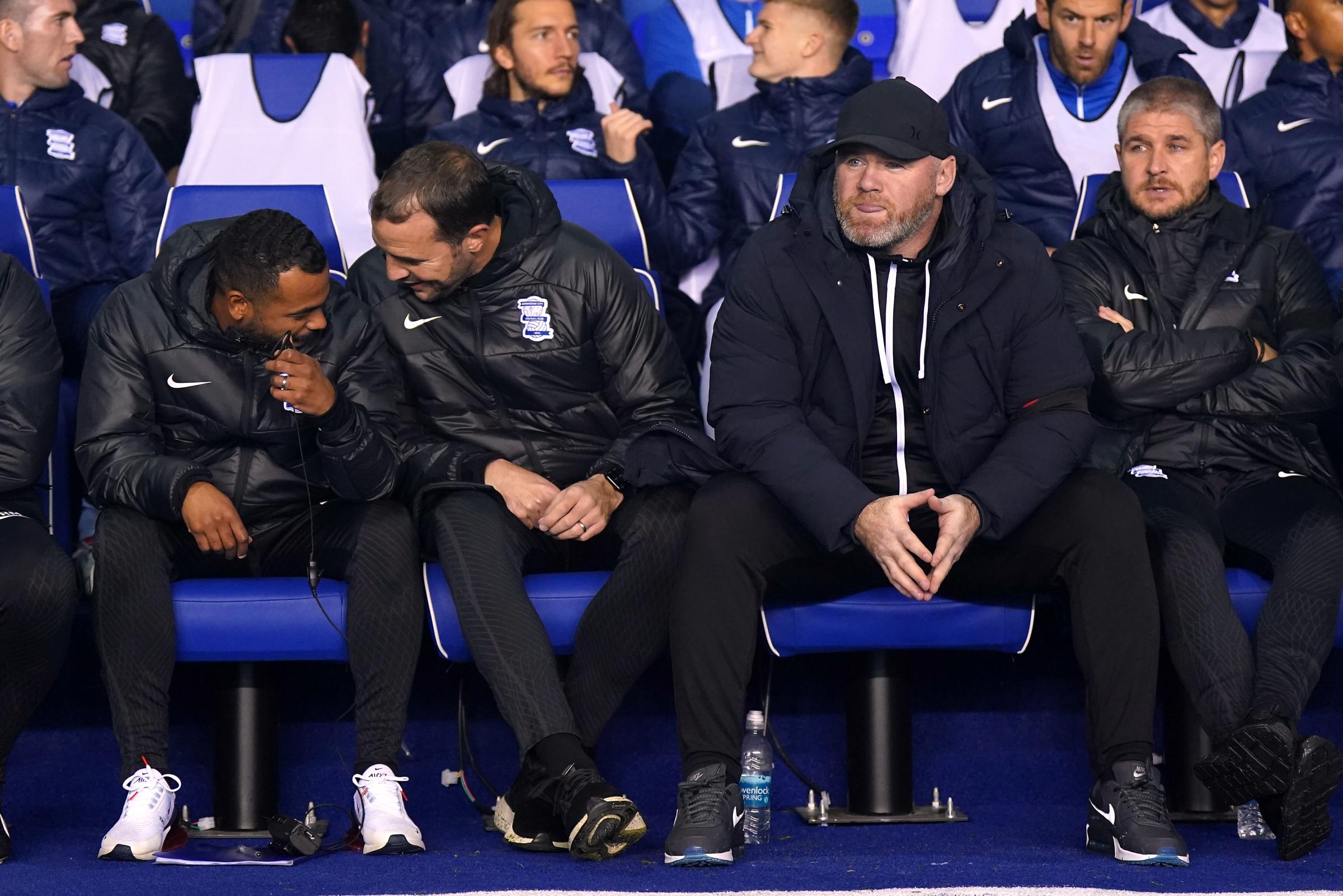 Ashley Cole on the bench alongside Wayne Rooney