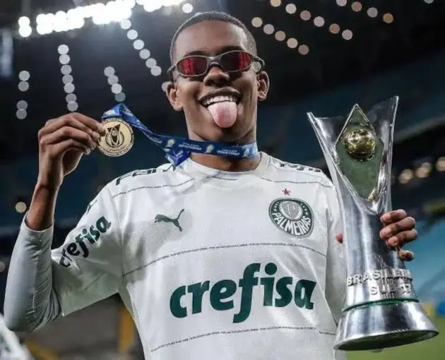 Estevao Willian celebrates with a Championship medal.