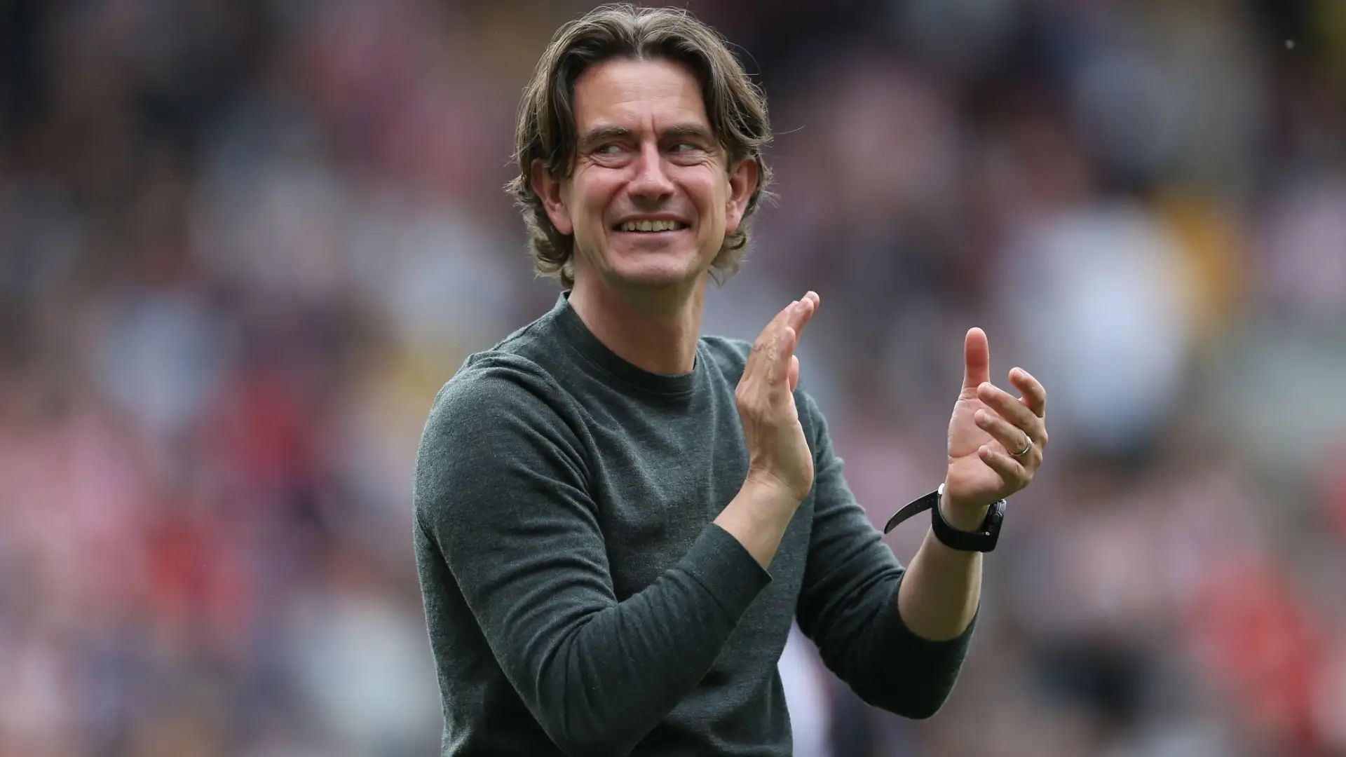 Thomas Frank applauds the fans.