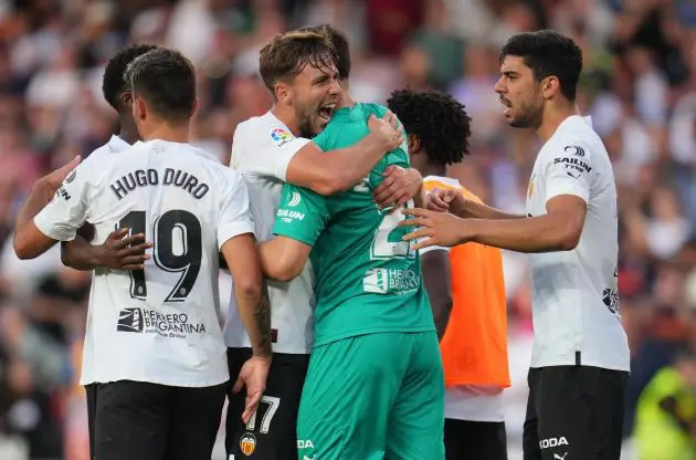 Giorgi Mamardashvili celebrates with his team mates