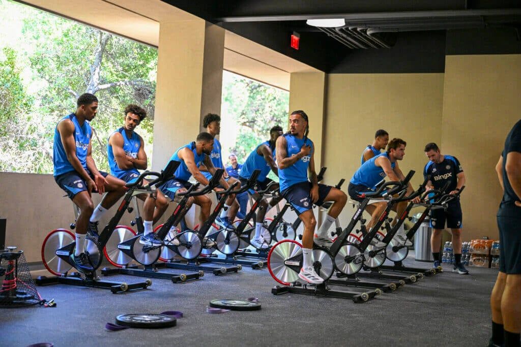 Chelsea players training on static bikes in preseason.