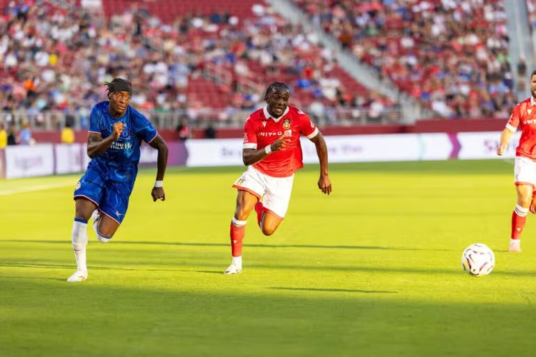 Noni Madueke takes on a full back for pace in preseason.