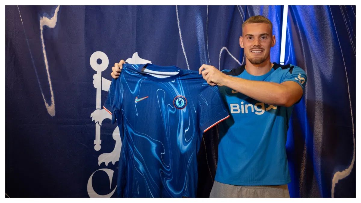 Filip Jorgensen holds up his Chelsea shirt. Filip Jorgensen holds up his Chelsea shirt.