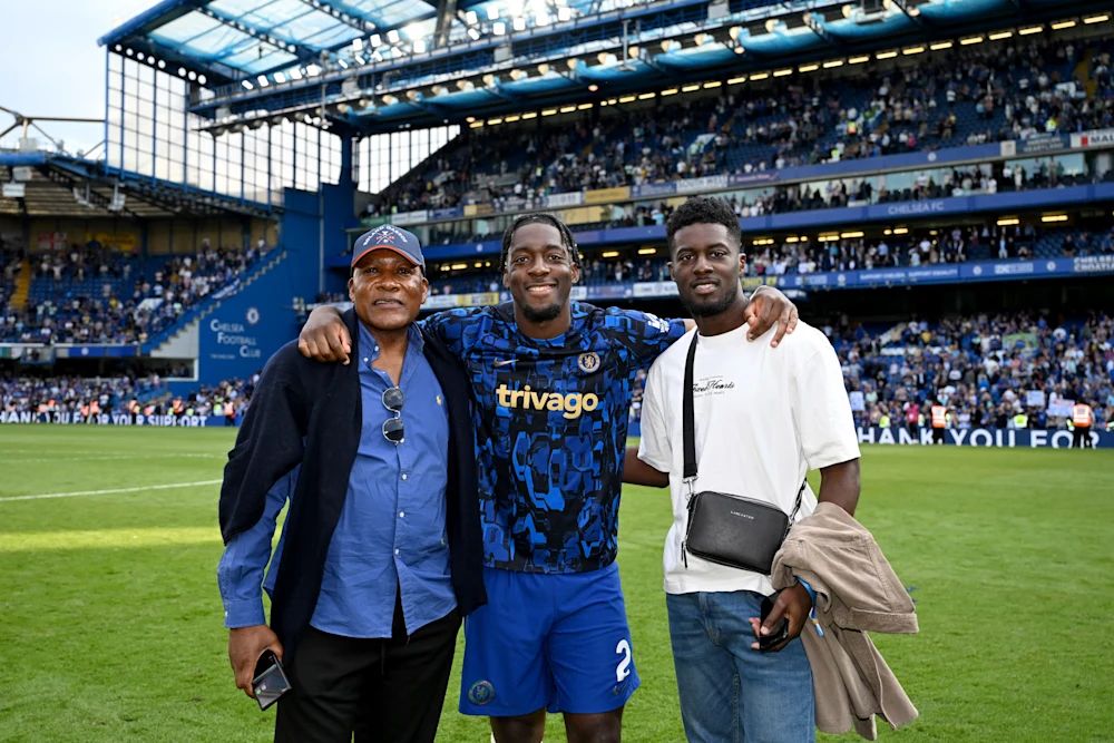 Axel Disasi with his family on the pitch at Stamford Bridge.