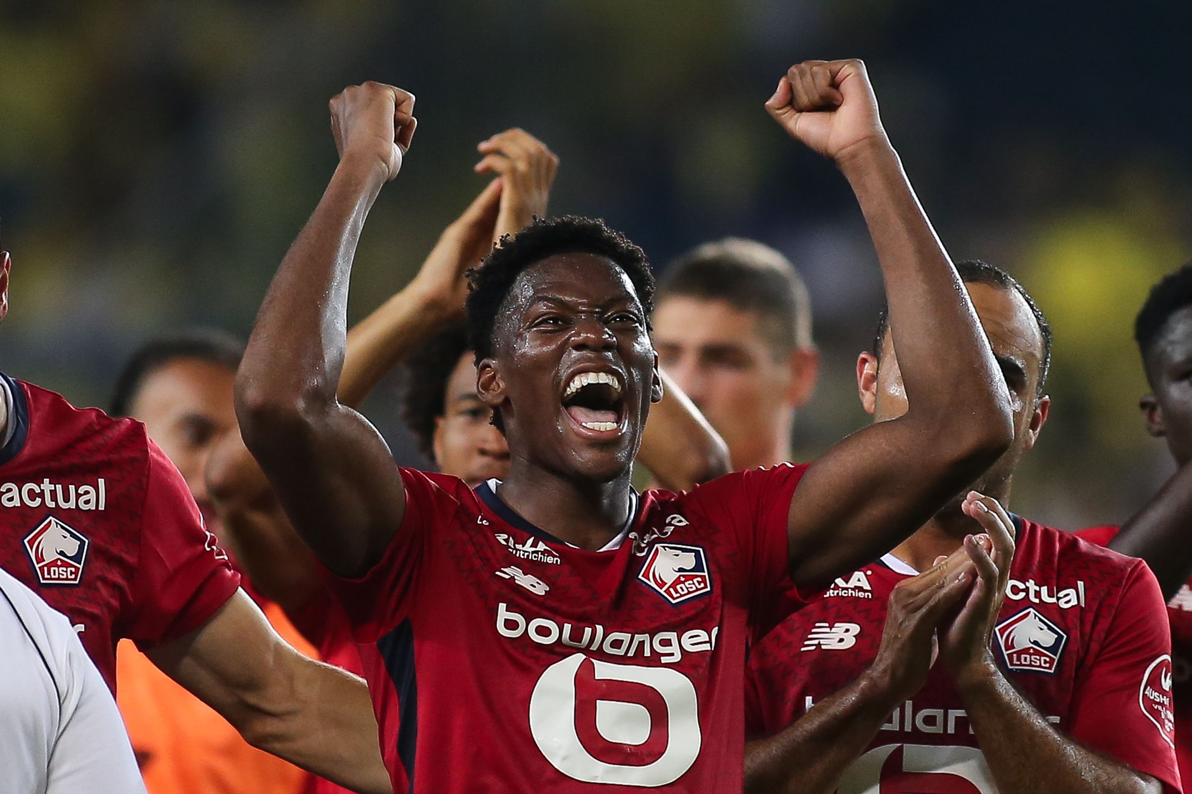 Jonathan David celebrates Champions League win with Lille. (Photo by Ahmad Mora/Getty Images)