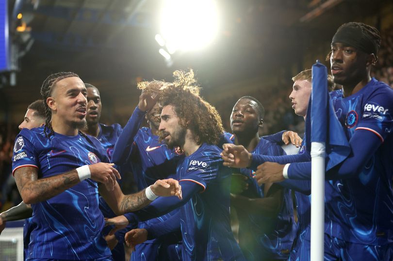 A group of Chelsea players celebrate by the corner flag at Stamford Bridge. (Image: Chris Lee - Chelsea FC)