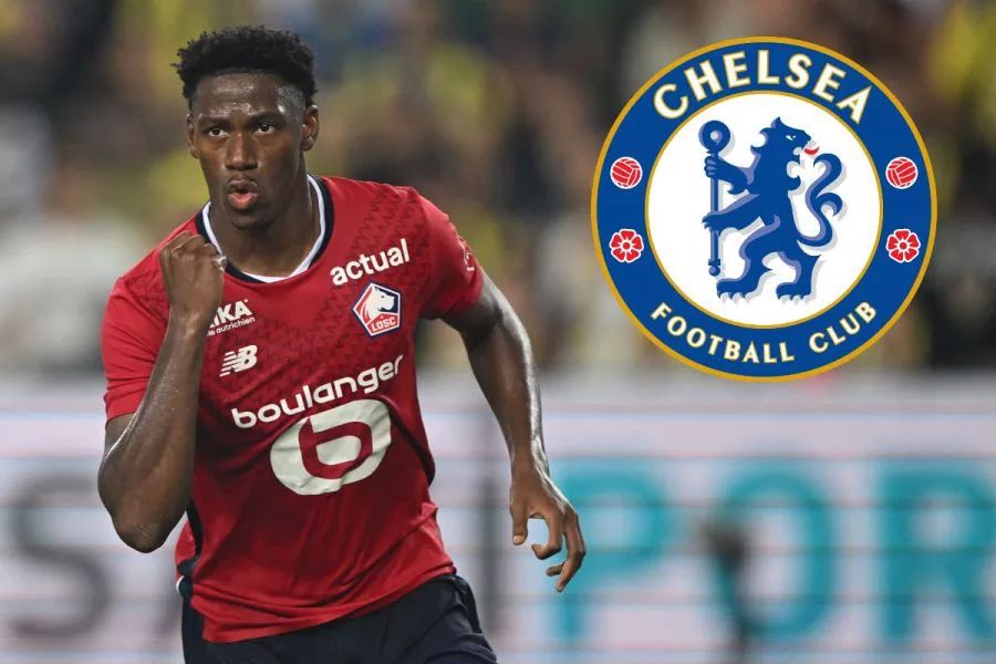 Jonathan David with a Chelsea logo.  (Photo by Ozan KOSE / AFP)