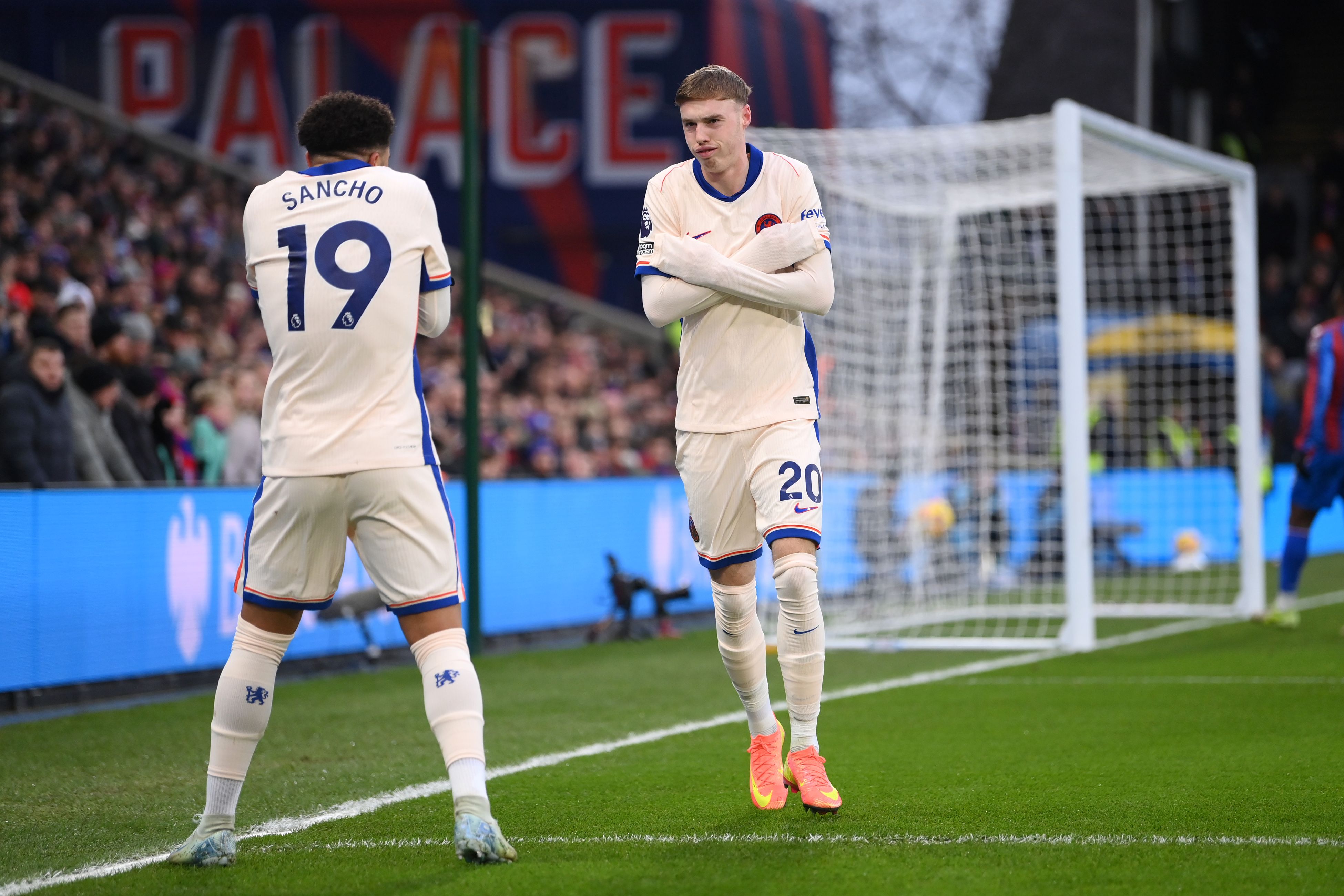 Jadon Sancho and Cole Palmer celebrate against Crystal Palace. (Photo by Justin Setterfield/Getty Images)