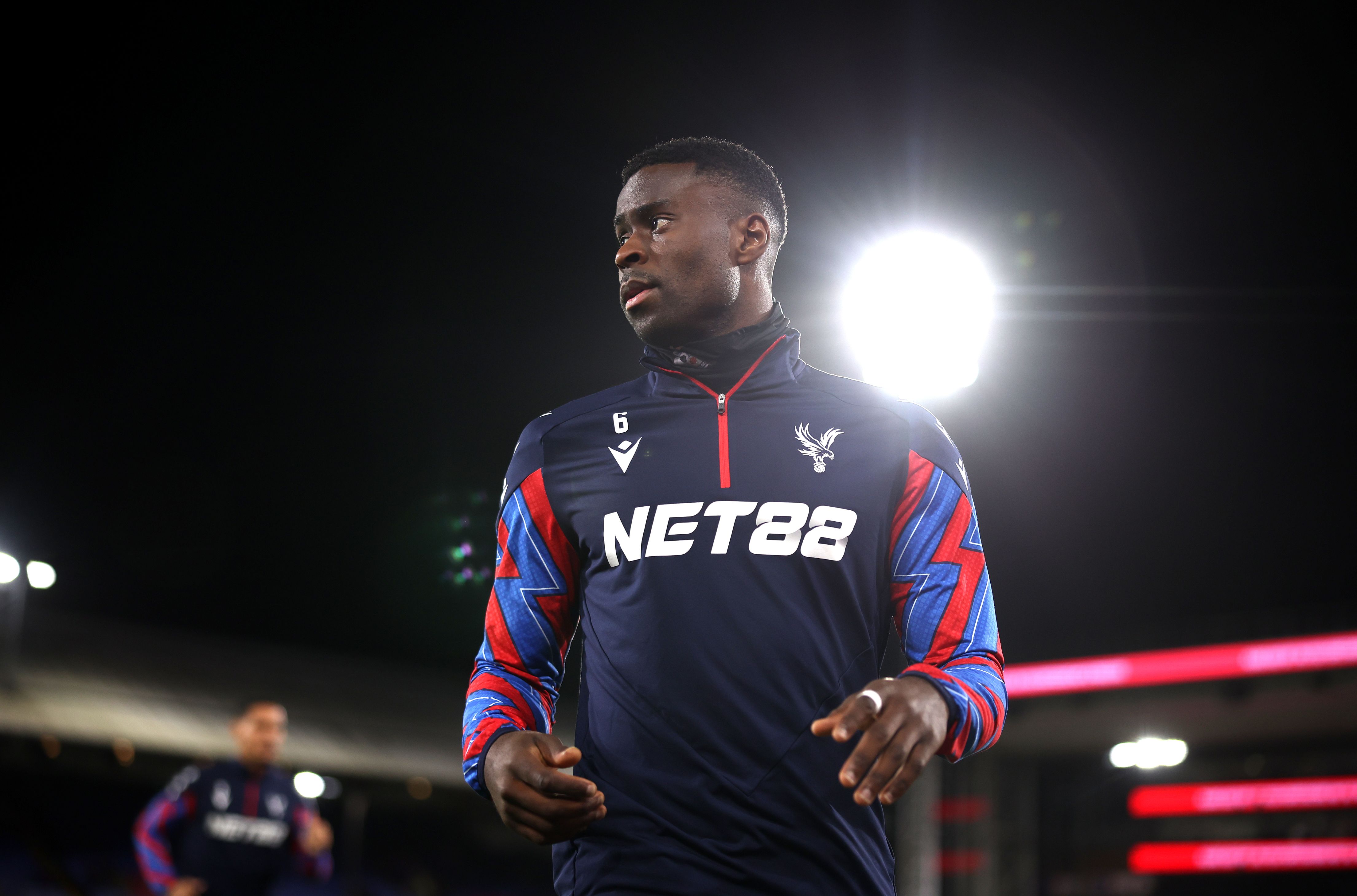Marc Guehi warms up for Crystal Palace.
