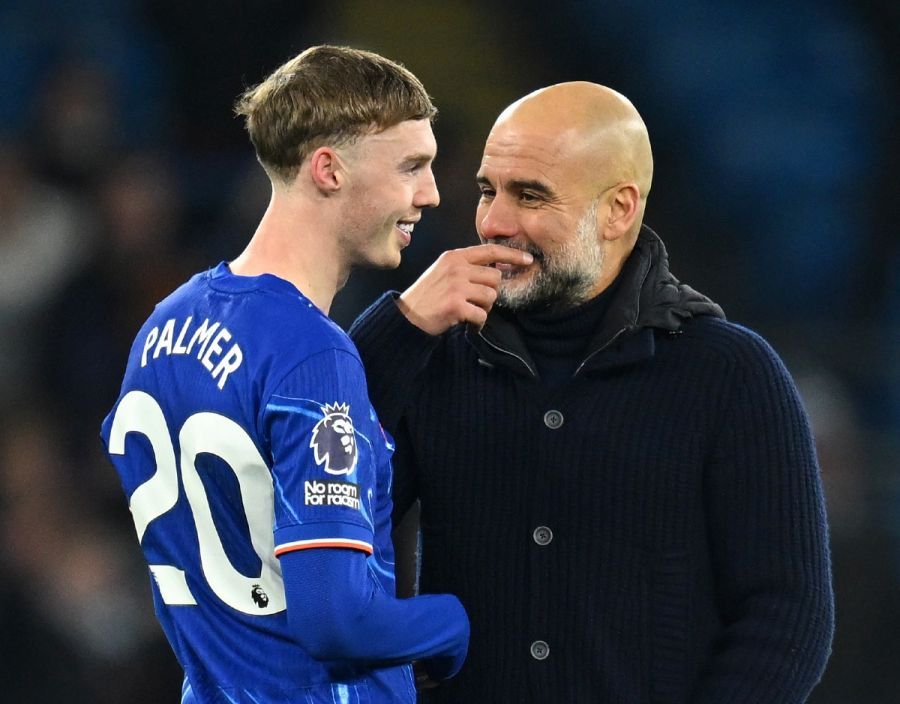 Cole Palmer smiles and chats with Pep Guardiola.