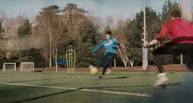 Aaron Anselmino pings one in during training.