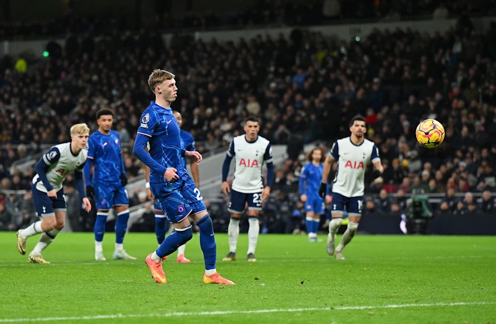 Cole Palmer dinks a penalty against Tottenham.