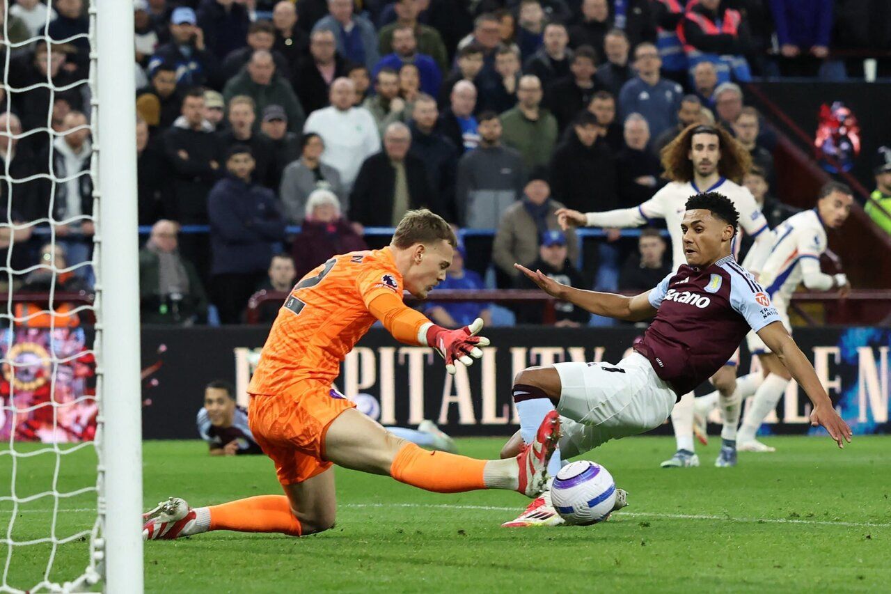 Filip Jorgensen makes a good save from Ollie Watkins.