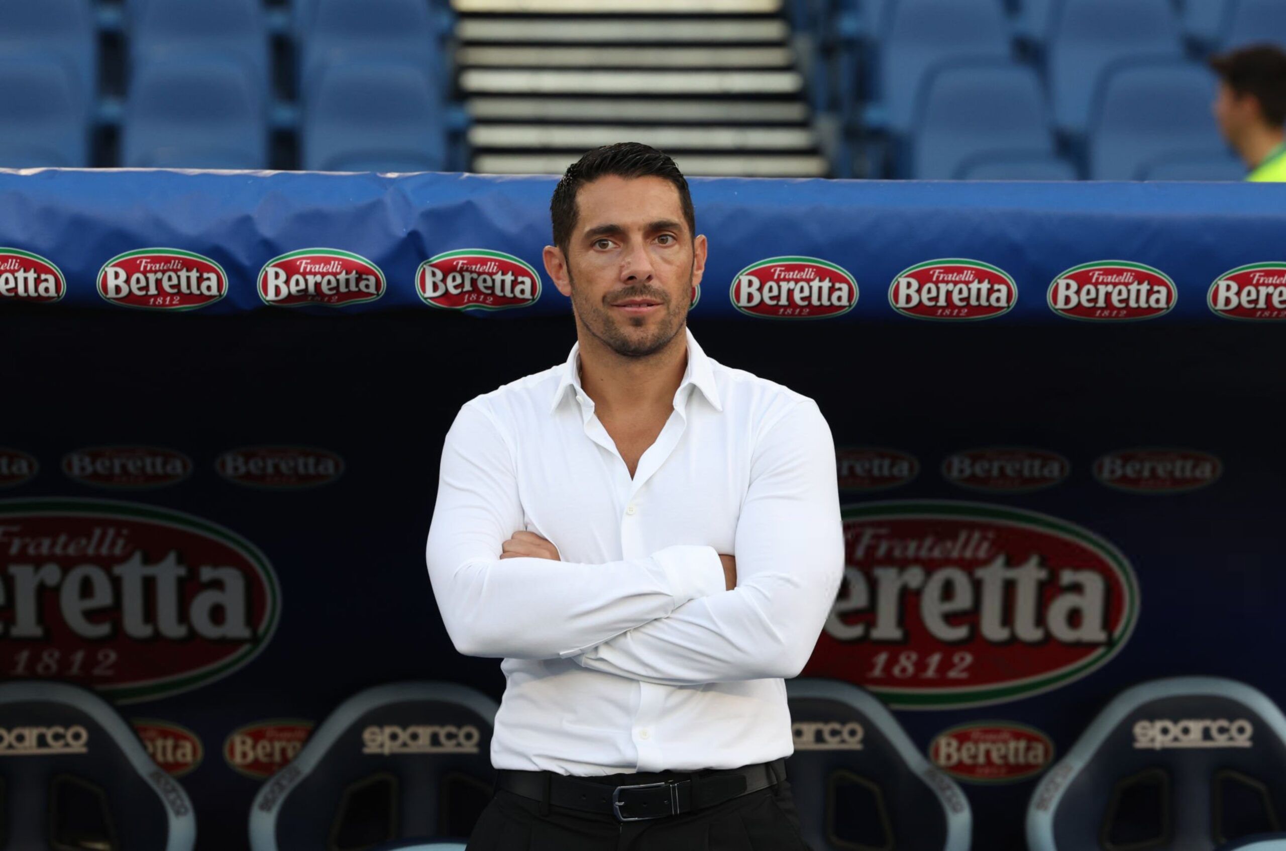 Geoffrey Moncada of AC Milan on the sidelines.