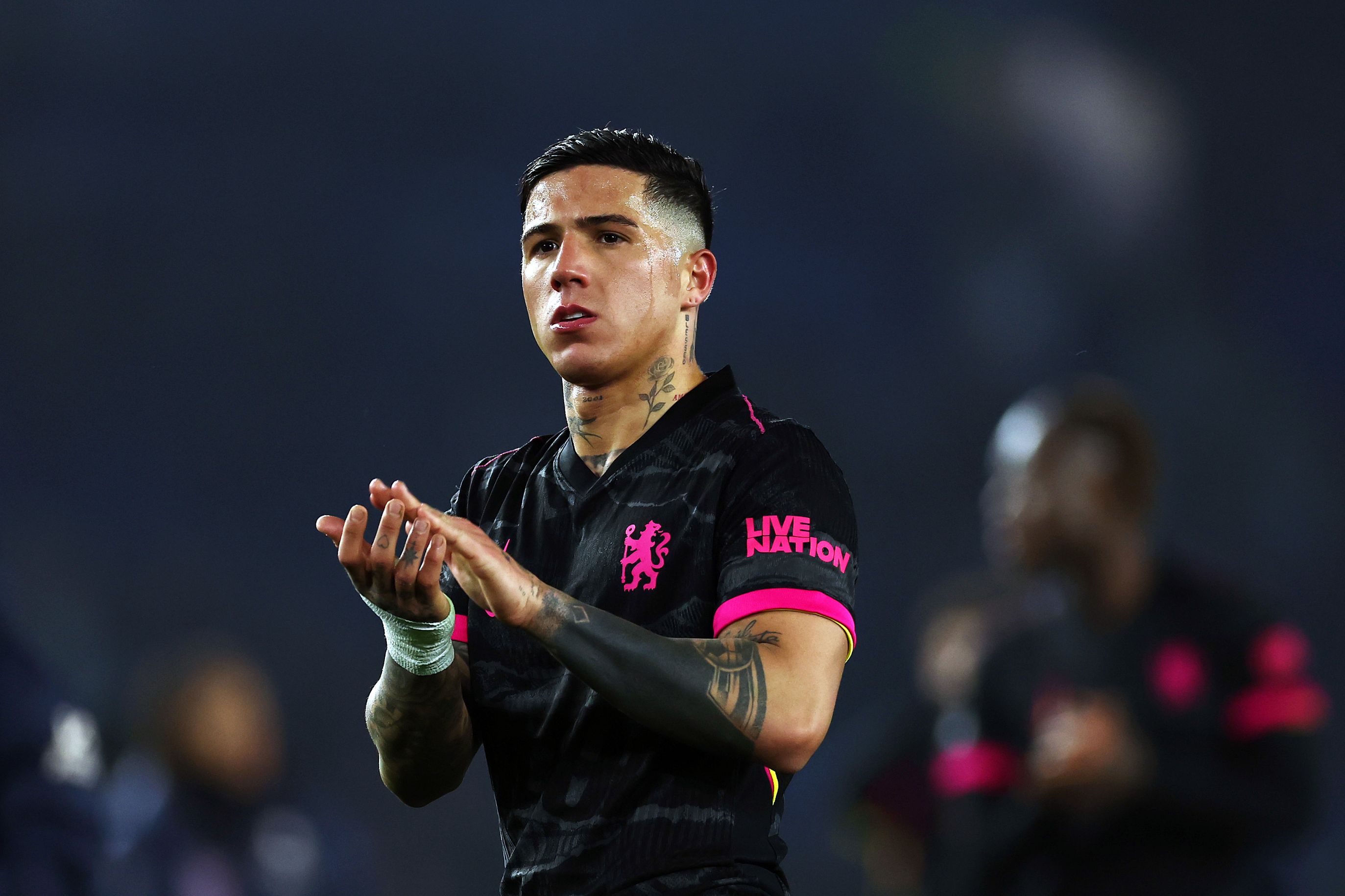 Enzo Fernandez applauds fans after Brighton defeat.