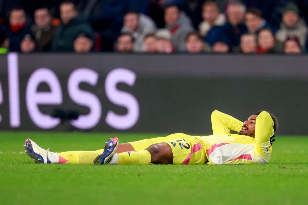 Renato Veiga lies injured on the grass.