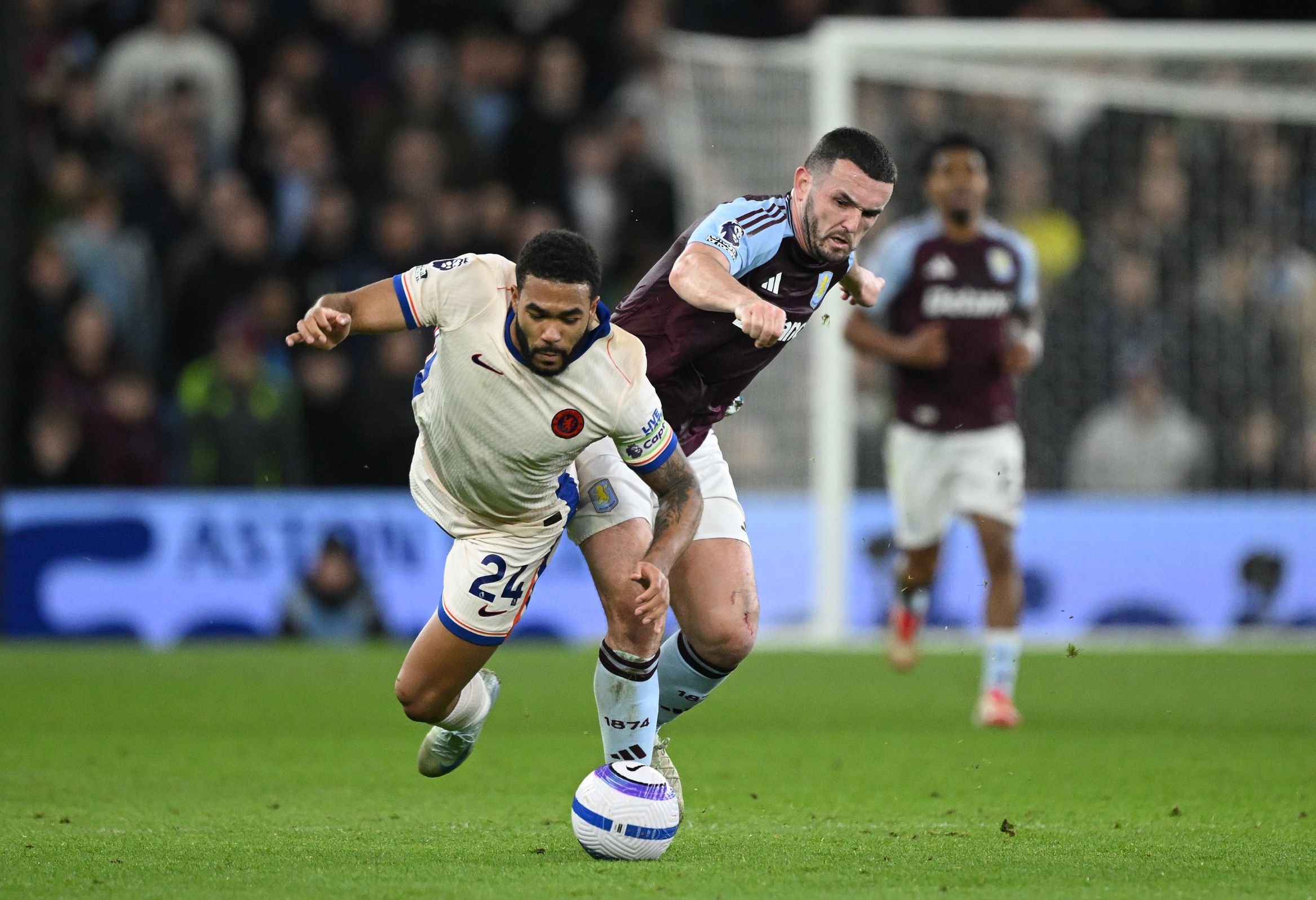 Reece James battles for possession against Aston Villa.