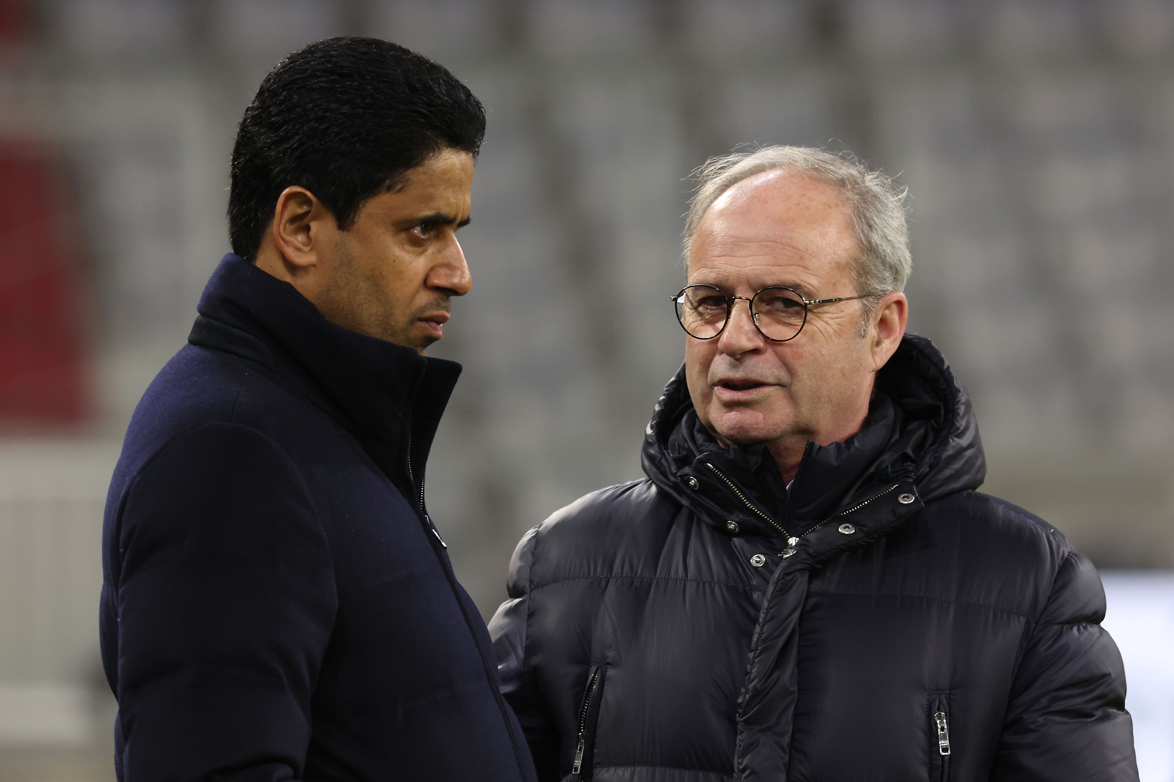 Luis Campos in conversation with PSG President Nasser Al-Khelaifi.