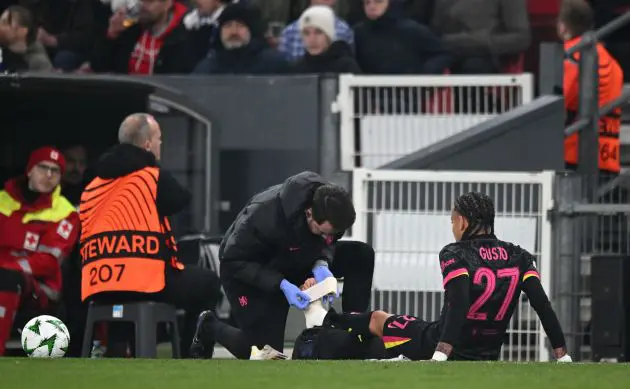 Malo Gusto gets treatment on the pitch.