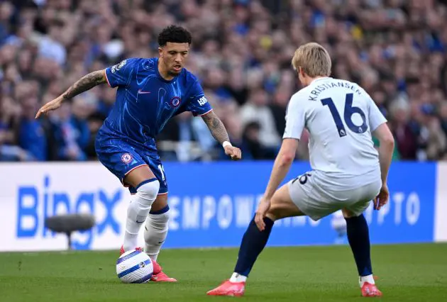 Jadon Sancho battles for possession against Leicester.