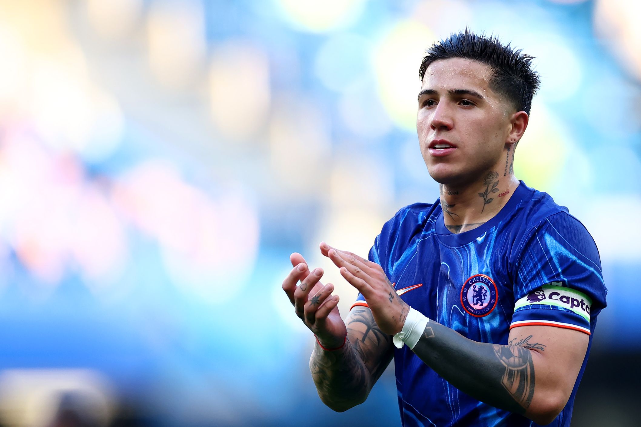 Enzo Fernandez applauds Chelsea fans after Leicester win.