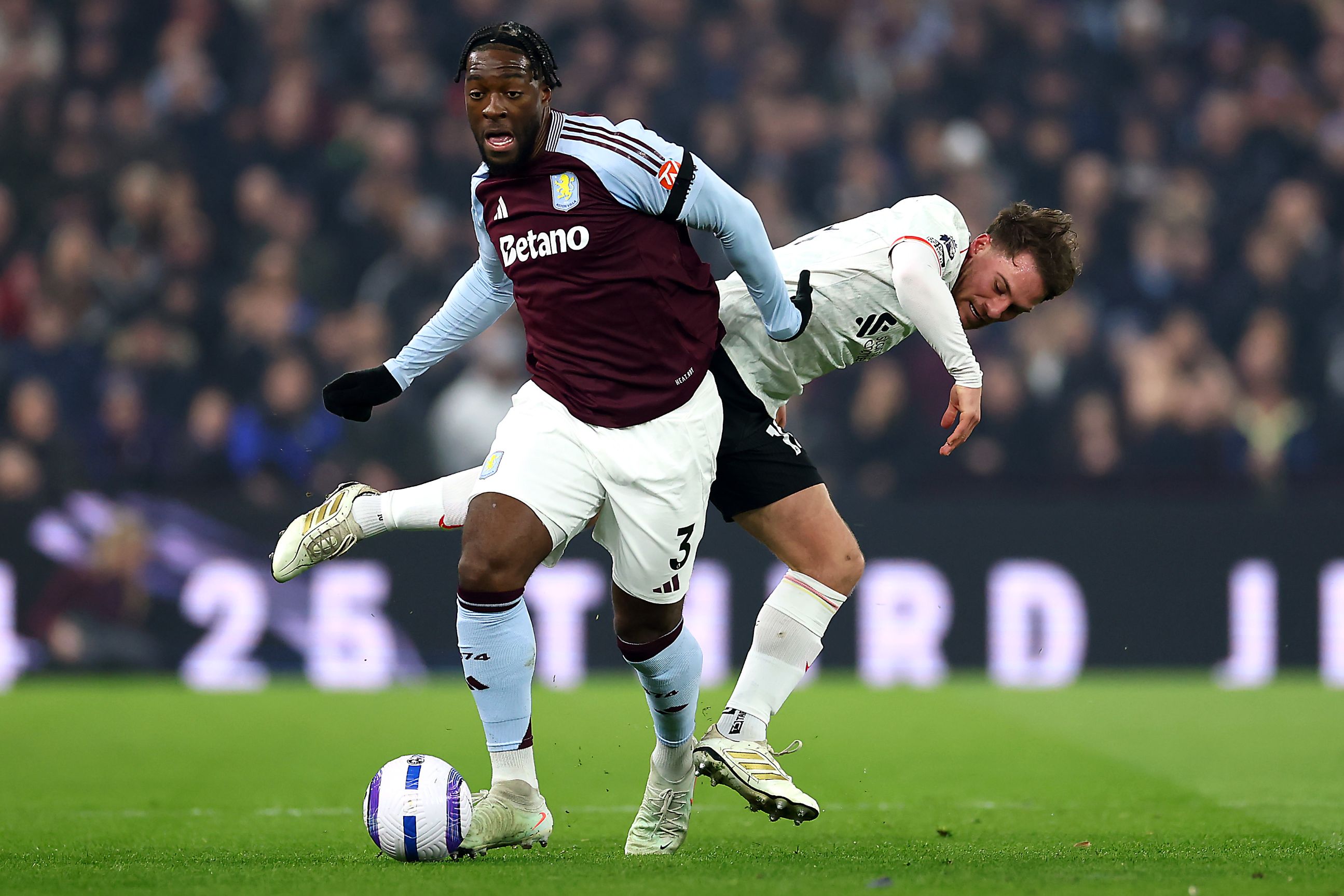 Axel Disasi shrugs off a challenge.