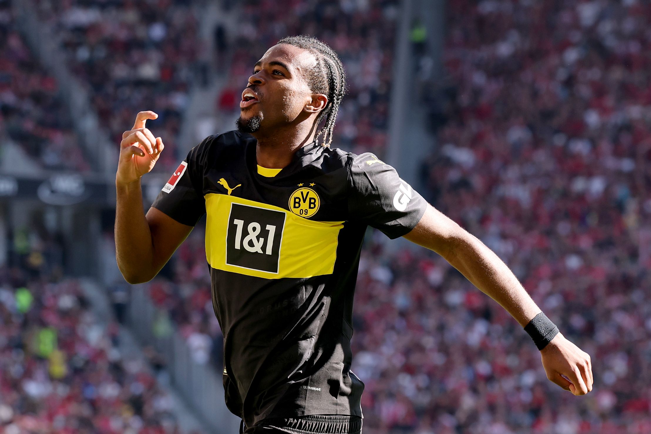 Carney Chukwuemeka celebrates scoring for Borussia Dortmund.