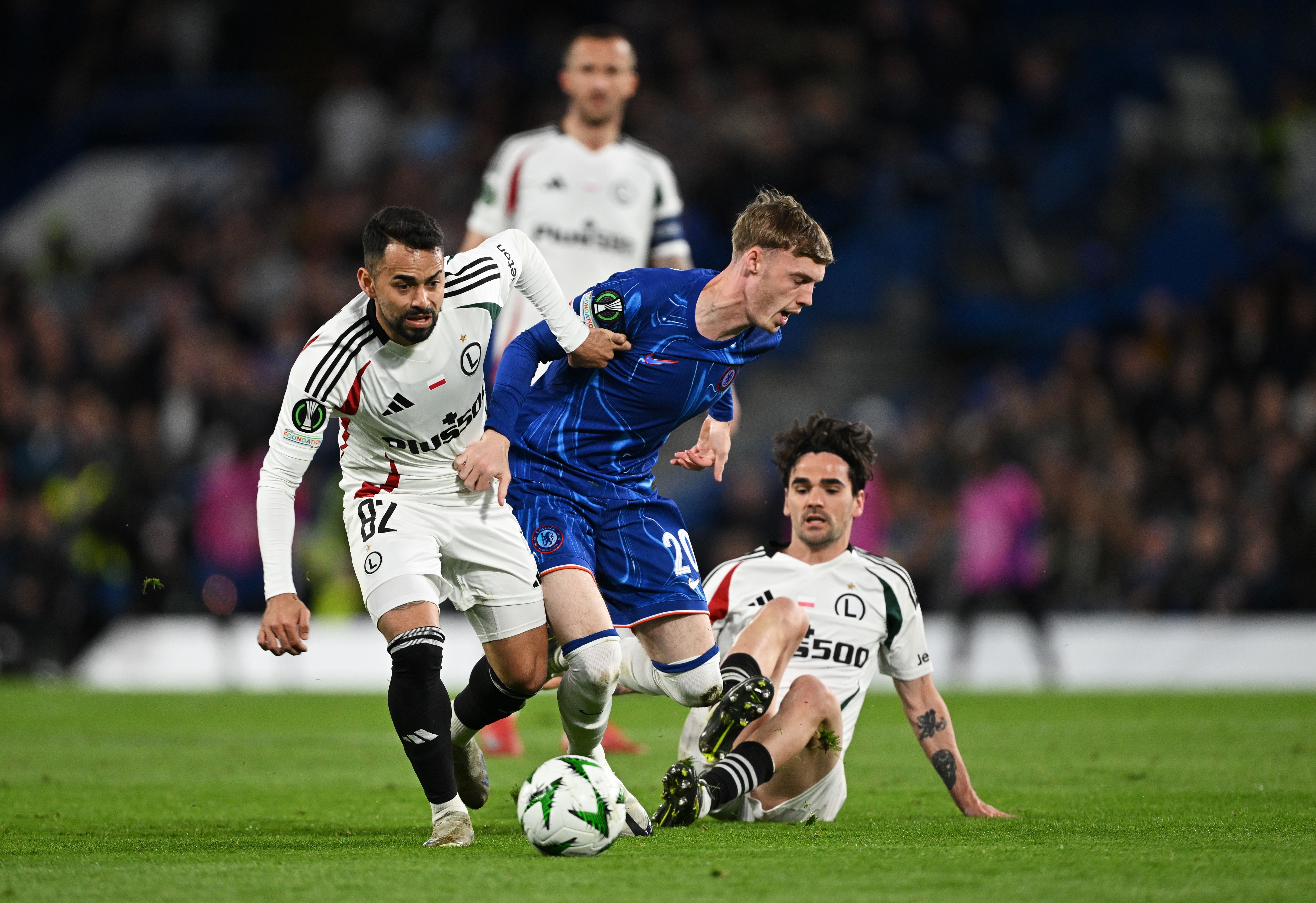 Cole Palmer battles for possession against Legia Warsaw.