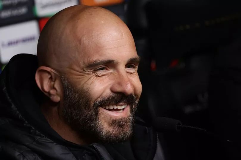 Enzo Maresca laughs during a Chelsea press conference