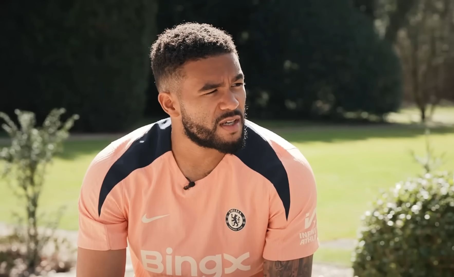 Reece James speaks in the garden at Cobham.